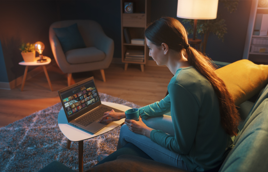 woman watching connected tv on laptop